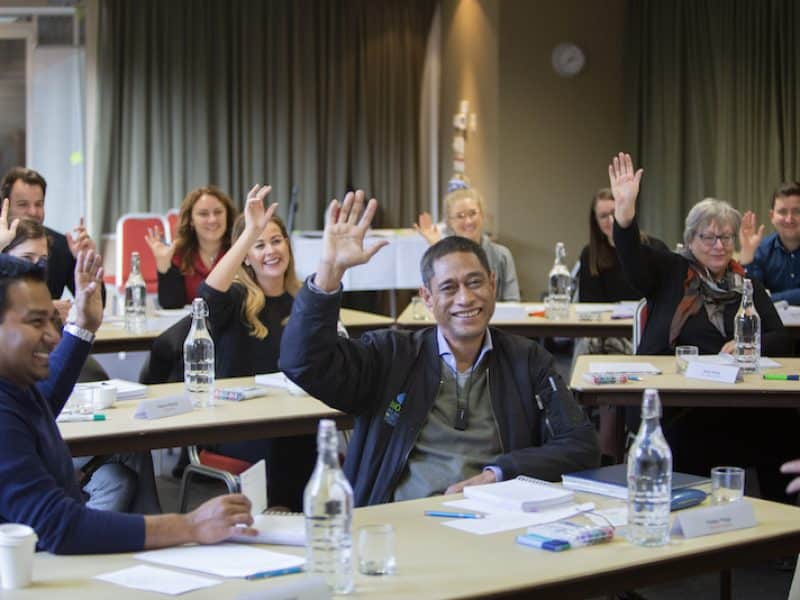 group-hands-up-seeing-faces-1
